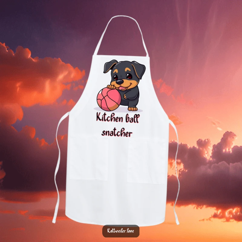 Funny Rottweiler apron showing a dog playfully nudging a large, bouncy ball, perfect for cooking and baking with a dose of canine enthusiasm.