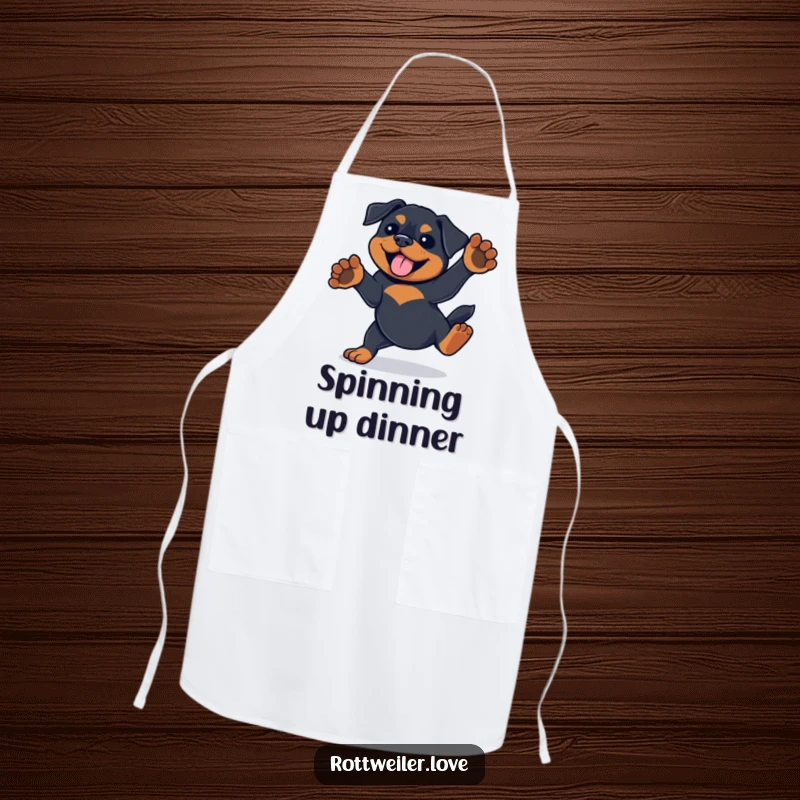 Funny Rottweiler apron design showing the dog doing a playful spin with paws in the air, perfect for kitchen fun.