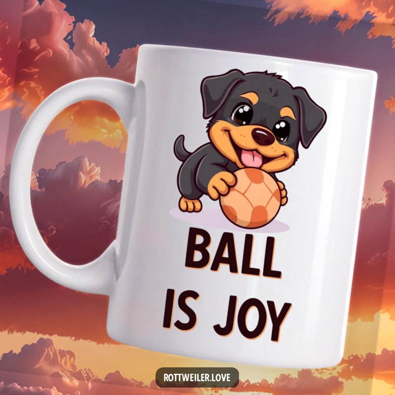 Funny Rottweiler mug showing a dog with happy eyes playfully nudging a rolling ball, radiating sweetness and a love for play.