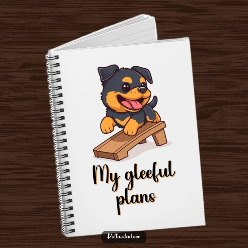 Funny Rottweiler notebook showing a happy Rottweiler sliding down a ramp with a gleeful bark. Lined pages for notes.