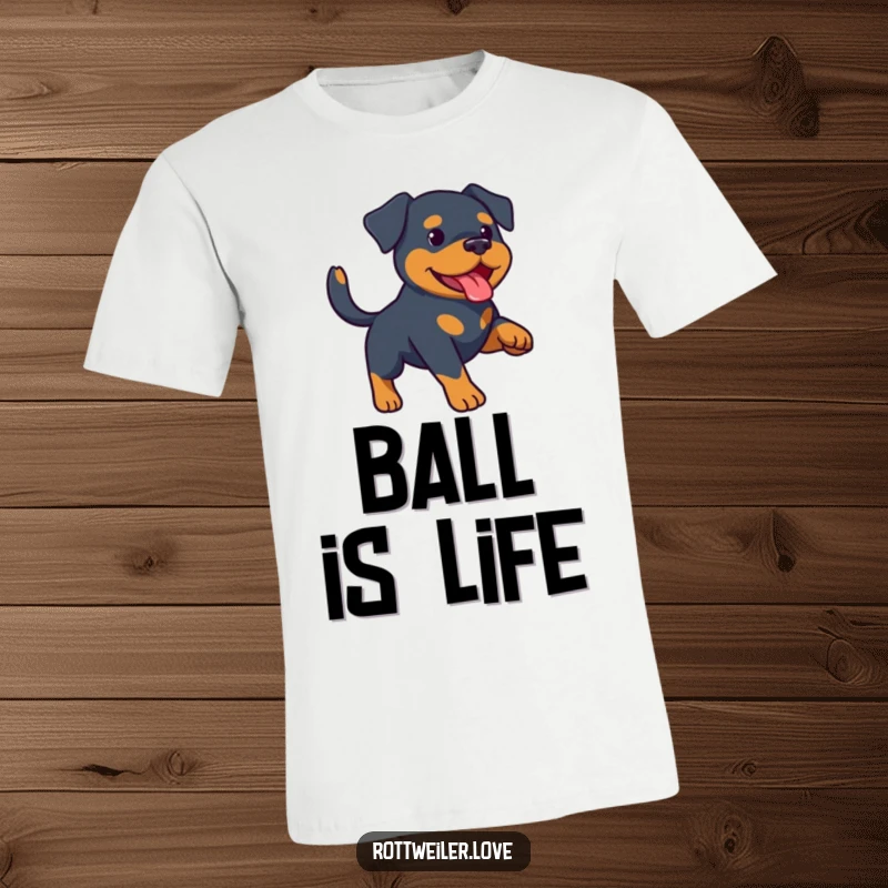 Funny Rottweiler t-shirt showcasing a happy Rottweiler in mid-air, catching a ball during a game of fetch. Comfy cotton tee.