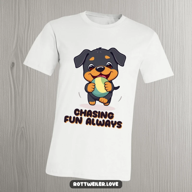 Funny Kawaii Rottweiler t-shirt featuring a playful chase of a bouncy toy with pure glee.