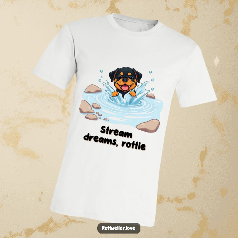 Funny Rottweiler T-Shirt showing a dog playfully splashing in a clear, cool stream, radiating happiness and a love for water.
