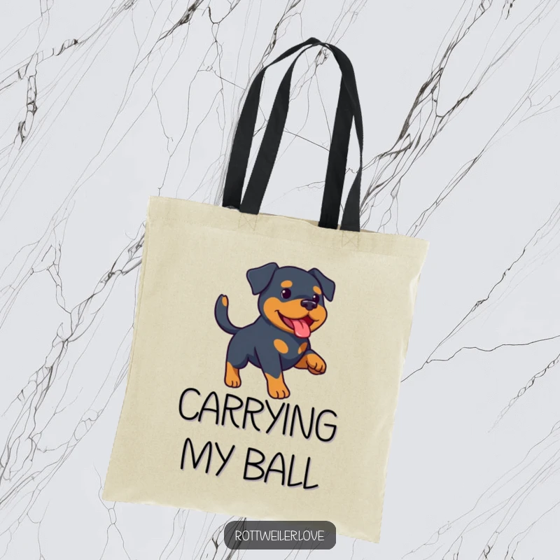 Funny Rottweiler tote bag illustrating a happy Rottweiler lunging for a ball during a game of fetch. Durable canvas for everyday use.