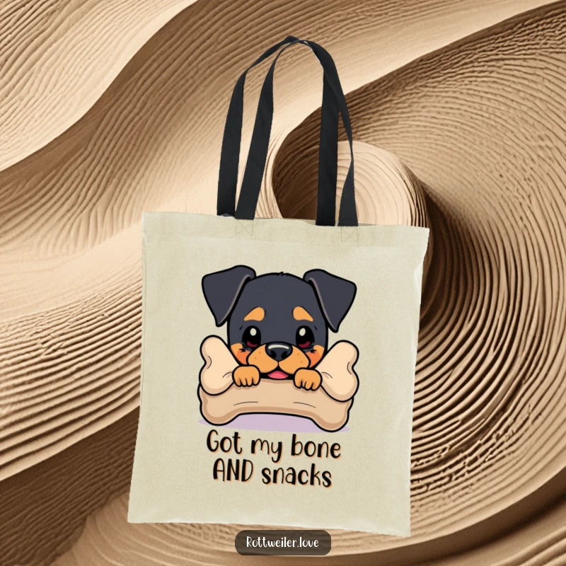 Funny Rottweiler Tote Bag featuring a dog peeking from behind a bone, a humorous and practical accessory.